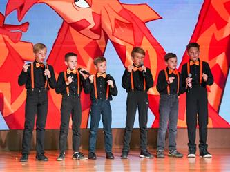 students lined up to sing on stage