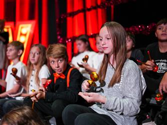 student orchestra performing on stage