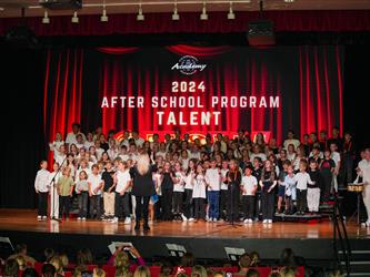 students lined up to sing on stage