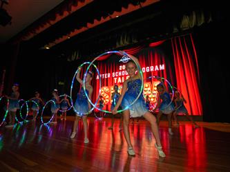 students performing on stage 