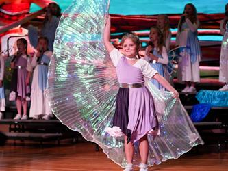 students performing dance on stage