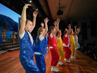 students dancing on stage for talent show