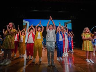 students performing a play for talent show