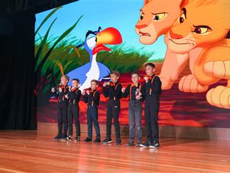 students lined up to sing on stage