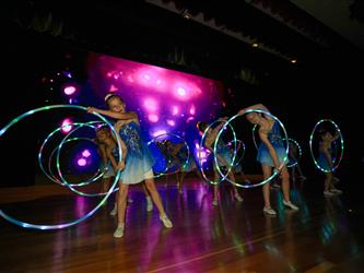 students performing on stage 