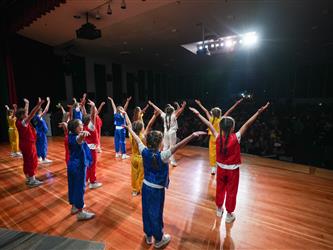 students dancing on stage for talent show