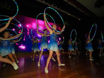 students performing on stage 